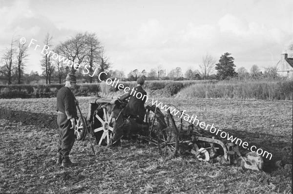 FARM SCENE AT CONROY'S TRACTOR PLOUGHING